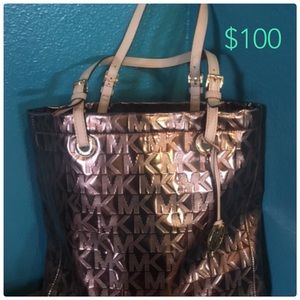 Authentic MK tote.Used one month. Excellent!
